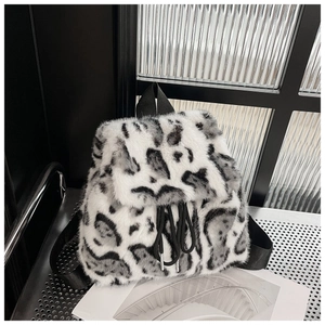 Detailed view of the leopard print faux fur backpack with black drawstring closure