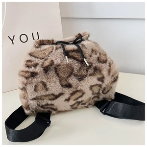 Detailed view of plush leopard print backpack with durable nylon straps and drawstring