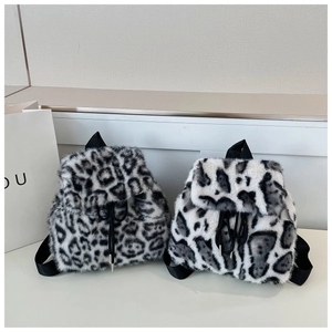 Detail of leopard print faux fur backpack with drawstring closure and nylon straps