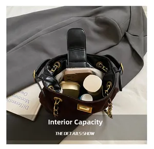 Internal view of the chain bucket bag showing space for phone and cosmetics