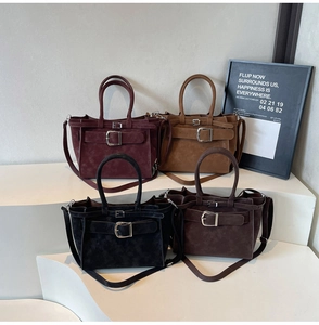 Detail of four matte suede shoulder bags in burgundy, camel, black, and dark brown colors