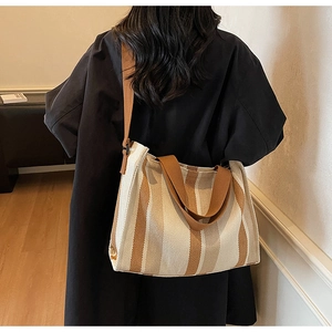 Close-up of the vertical striped canvas tote bag texture with long and short straps