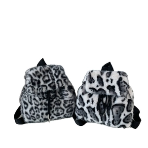 Plush faux fur drawstring backpack in leopard and spotted patterns for winter fashion