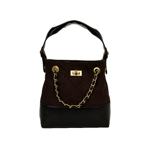 Quilted two-tone bucket bag with chain strap and gold hardware on white background