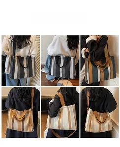 Detail showing various striped canvas tote bags with hand straps and long shoulder belts