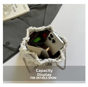 Detail view of denim bucket bag interior showing spacious capacity for daily essentials
