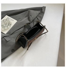 Internal structure of a retro suede baguette bag with three compartments and a zip pocket