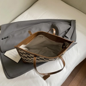 Top view of spacious checkerboard tote bag interior with zipper pocket and lining