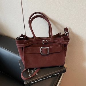Vintage burgundy suede underarm bag with large metal buckle and top handles