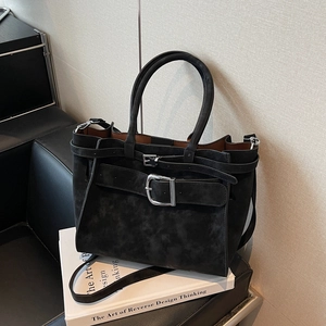Retro black faux suede shoulder bag with belt buckle detail and detachable strap