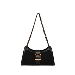 Vintage black baguette bag with gold buckle and metal chain strap on white background