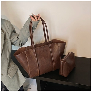 Detail view of deep brown vintage tote bag set with inner pouch and Fashion text print
