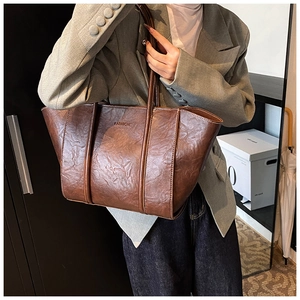 Brown tote bag with vintage wrinkled texture and embossed FASHION lettering