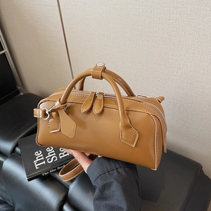 Classic tan Boston handbag in premium synthetic leather with dual handles and shoulder strap