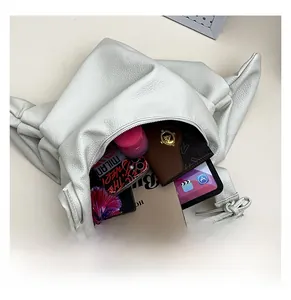 Interior storage capacity of the white leather tote bag showing space for iPad and essentials