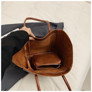 Top view of deep brown vintage tote bag showing interior space and matching inner pouch