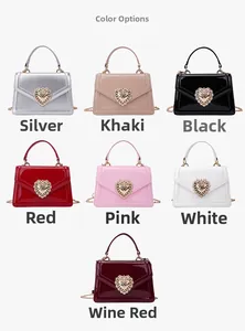 Multiple glossy patent leather crossbody bags with heart-shaped diamond pearl buckles