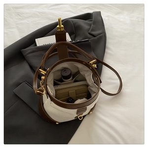 Top view of two-tone bucket bag interior showing spacious compartments for daily essentials
