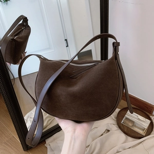 Retro coffee brown suede crescent shoulder bag with adjustable strap and zipper closure