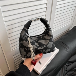 Black hobo shoulder bag with grey cloud pattern and decorative red heart pendant