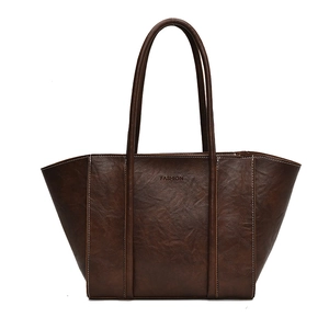 Minimalist brown faux leather tote bag with FASHION embossing and white stitching