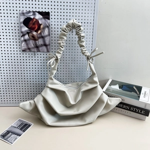 Minimalist beige pleated shoulder bag with adjustable drawstring strap for women