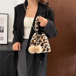 Fashionable leopard print plush shoulder bag with drawstring closure and chain strap