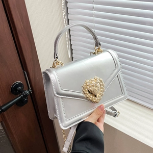 Silver patent leather crossbody bag with vintage golden heart pearl buckle and chain strap