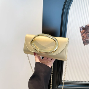 Champagne gold evening clutch with large oval metal handle and fine gold chain strap