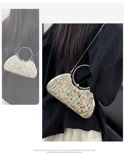 Detail view of silver liquid metal texture evening bag with circular metal handle