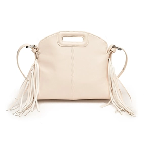 Close-up of the cream PU leather tote showing its matte texture and stylish side fringe detail
