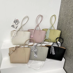 Detailed view of large tote bags in six colors with stylish checkered scarves on handles
