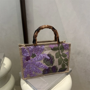 Embroidered jute tote bag with floral sequins and natural bamboo handles for women
