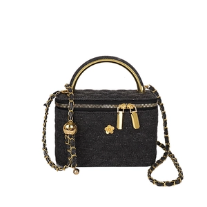 Quilted black denim chain crossbody bag with gold handle and floral charms