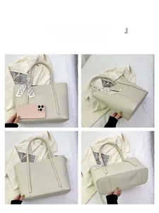 Detail view of cream tote bag with litchi texture and elegant printed silk scarf
