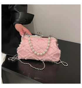Pink denim shell bag with pearl beads handle and silver kiss-lock closure details