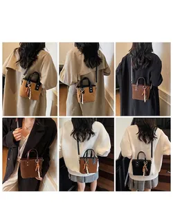 Detail of quilted leather bucket bags with wooden bead charms and shoulder straps