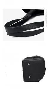 Detail view of the black lychee pattern cowhide bag handles and protective bottom rivets
