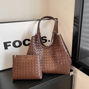 Deep brown woven tote bag set with matching inner pouch featuring classic woven texture