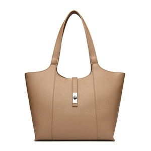 Close-up of litchi pattern leather tote bag with silver metal twist lock closure
