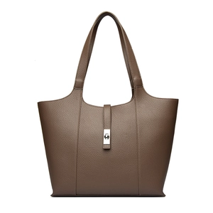 Large dark brown pebble leather tote bag with elegant metal twist lock and sturdy handles