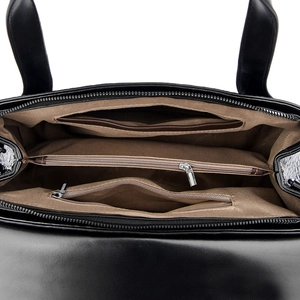 Internal view of the bag showing multiple compartments and brown logo lining detail