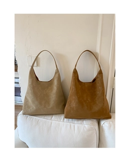 Detail view of large khaki hobo tote bag in faux suede with a minimalist design