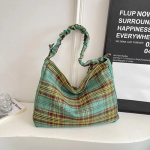 Minimalist green plaid canvas tote bag with drawstring handles for casual daily wear