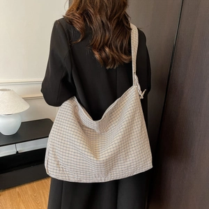 Fashionable oversized plaid crossbody bag with soft drawstring texture and wide strap