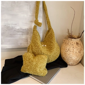 Detail view of ginger yellow plush tote bag and matching pouch with textured wool-like fabric