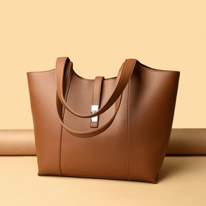 Brown litchi pattern leather tote bag with silver metal lock for women commuters