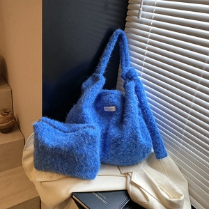 Electric blue faux fur tote bag and matching pouch set with minimalist logo patch