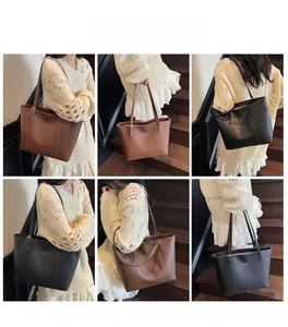 Mannequin portant un grand sac cabas en cuir noir et marron pour la mode automnale