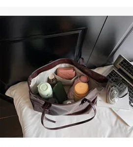 Interior view of large brown tote bag showing spacious capacity for daily essentials